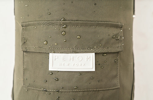 Close up of back leash hole and durable green fabric