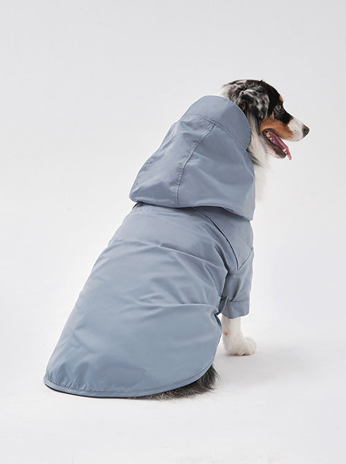Back view of pastel blue pet rain jacket featuring convenient leash portal