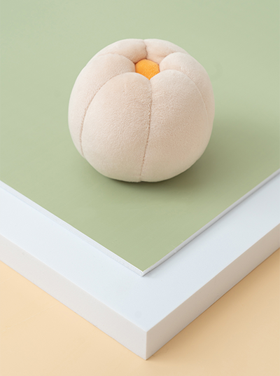 Front view of PEHOM Cucurbita plush dog toy in pumpkin flower shape
