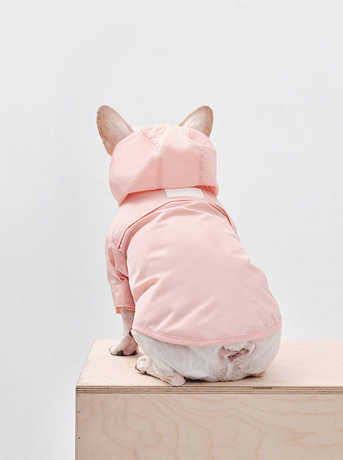Back view of pink pet rain jacket with leash hole detail