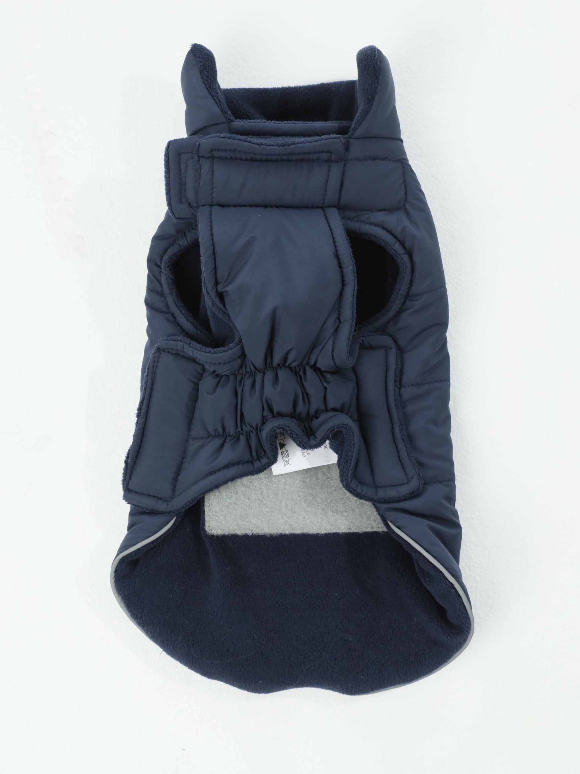 Detail showing the reversible feature with soft cozy fleece lining on the other side