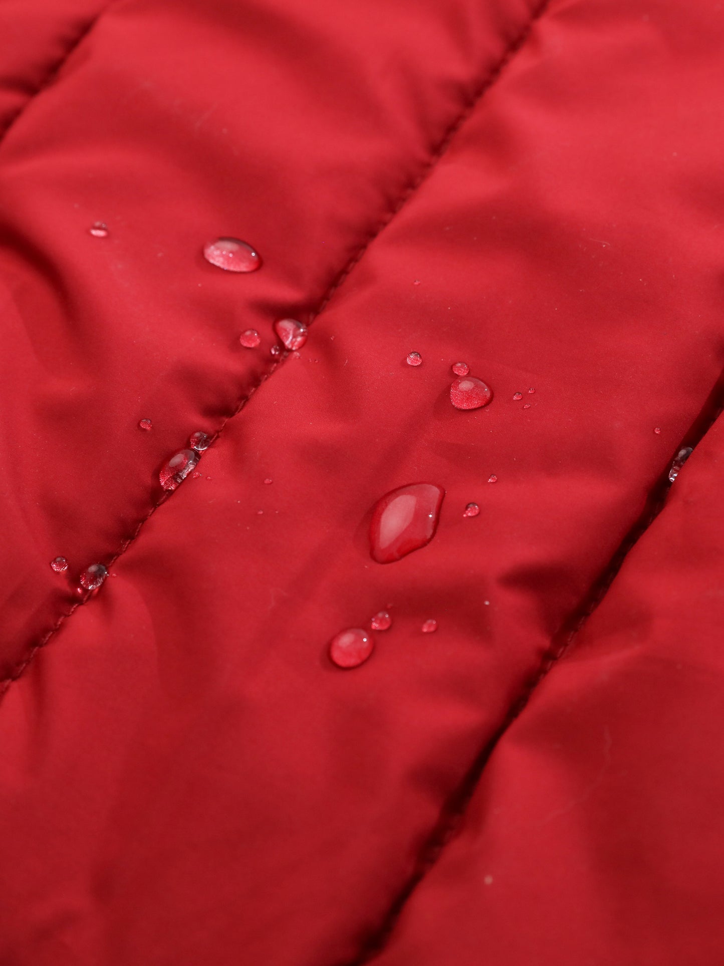 Detail showing the reversible feature with soft warm fleece lining on the red jacket