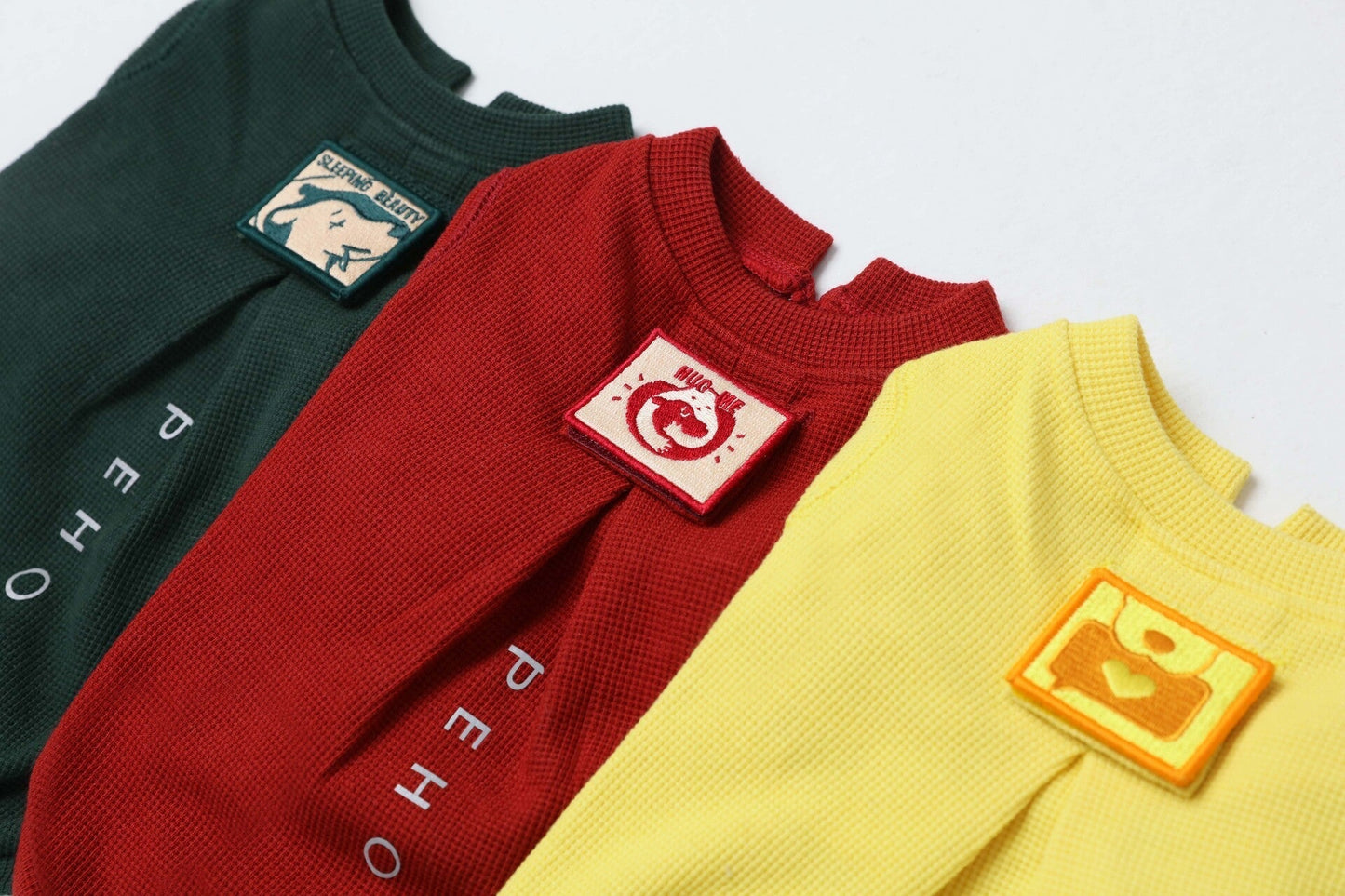 Close up of breathable honeycomb waffle knit texture on the green dog shirt